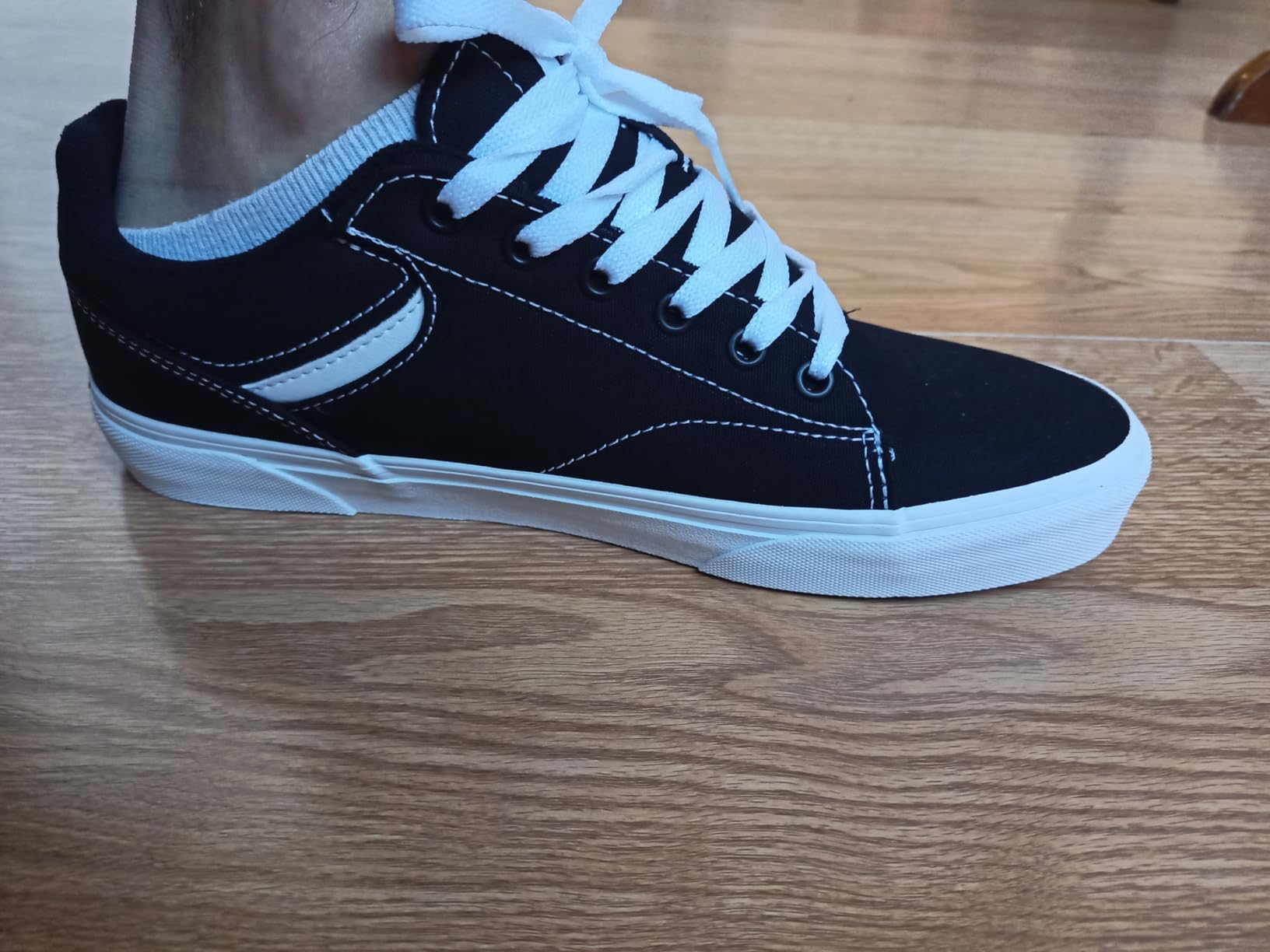 Vans Seldan showing detailed leather upper construction and padded collar design