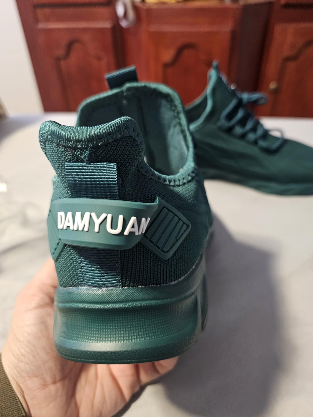 DLWKIPV Women's slip-on sneaker in emerald green showing full silhouette and lightweight mesh construction