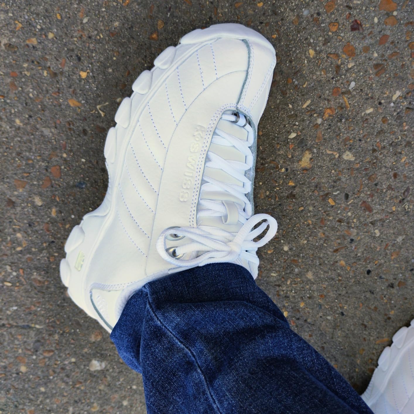 Women wearing K-Swiss ST329 CMF sneakers in everyday settings showing outfit versatility