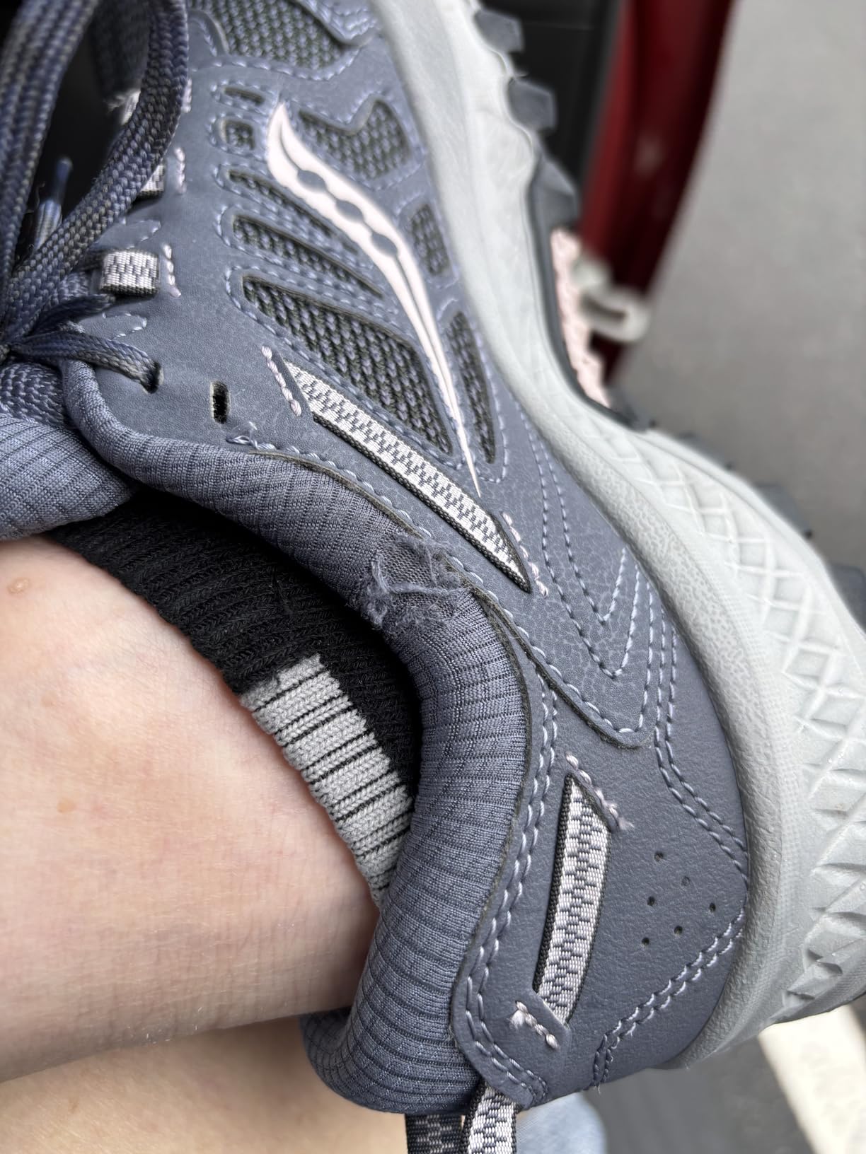 Comparison image showing Saucony TR13 durability issues with fabric tearing at ankle