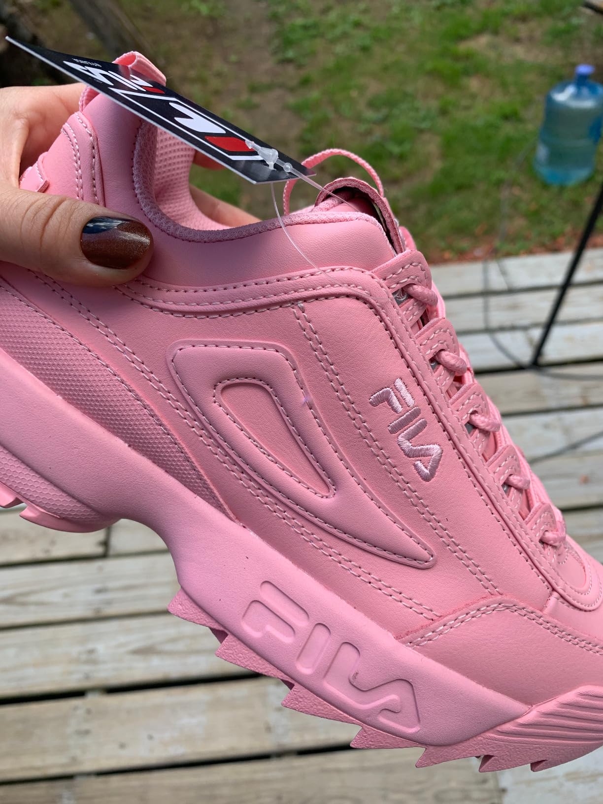 Fila Disruptor II blush pink colorway showing fashion-forward chunky platform sneaker design and retro style appeal