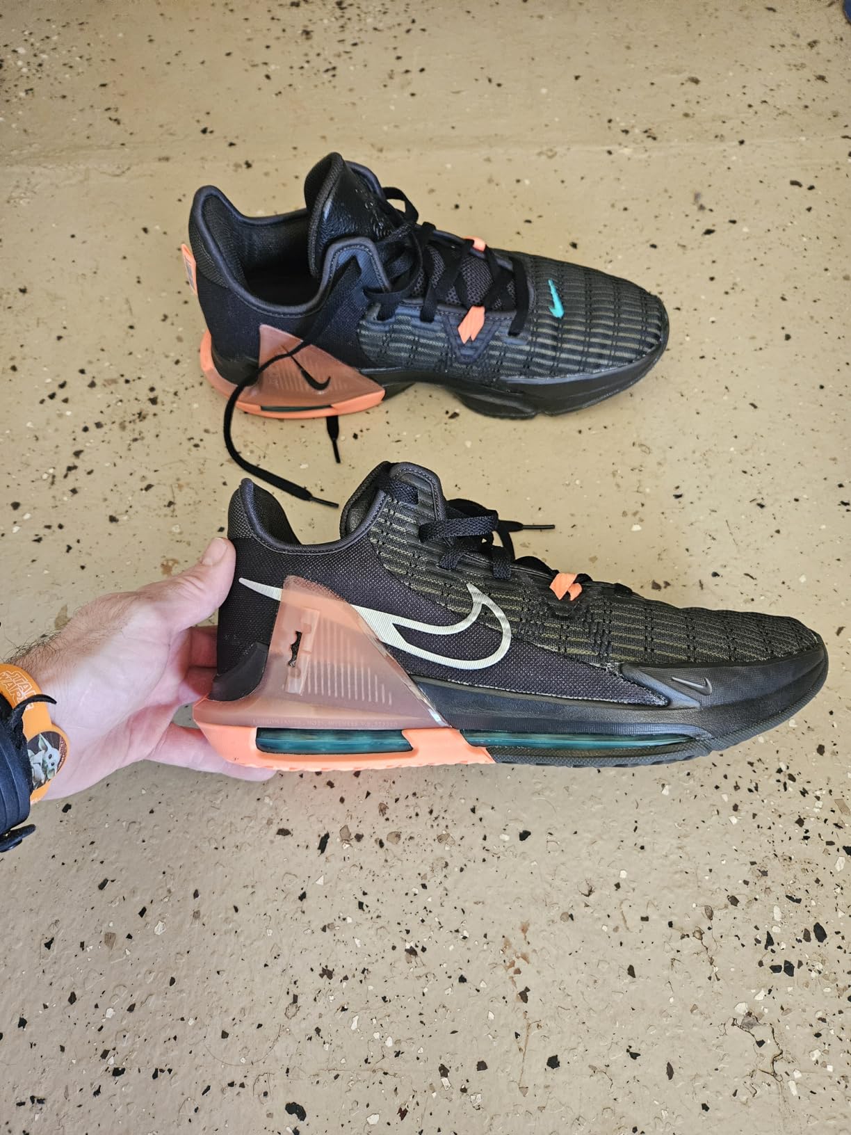 Nike LeBron Witness VI design details showing nylon lockdown cables, heel counter construction, and synthetic mesh upper