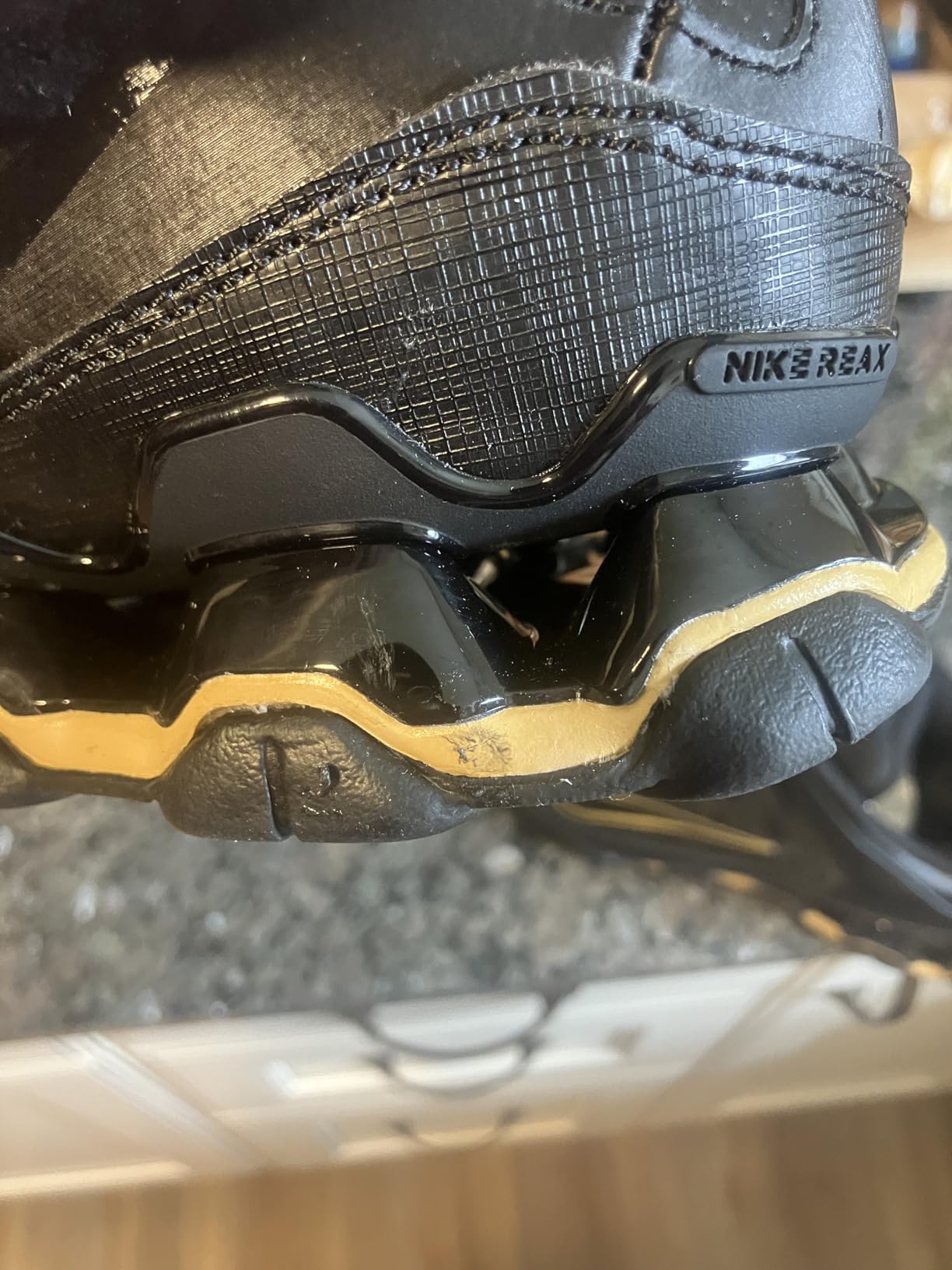 Side angle view of Nike Reax 8 TR showing profile construction and lateral stability features
