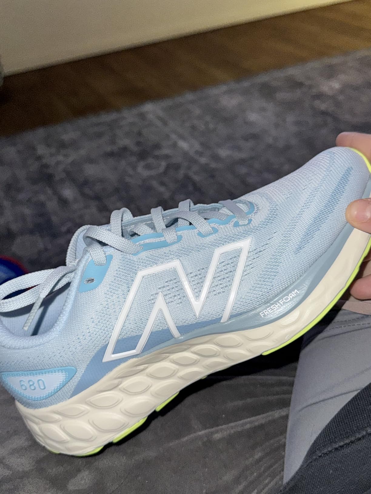 New Balance Women's Fresh Foam 680 V8 running shoe in light blue colorway with contrasting green outsole