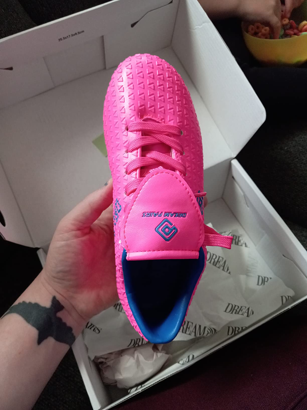 Multiple construction views of DREAM PAIRS soccer cleats showing upper detail and build quality for young players