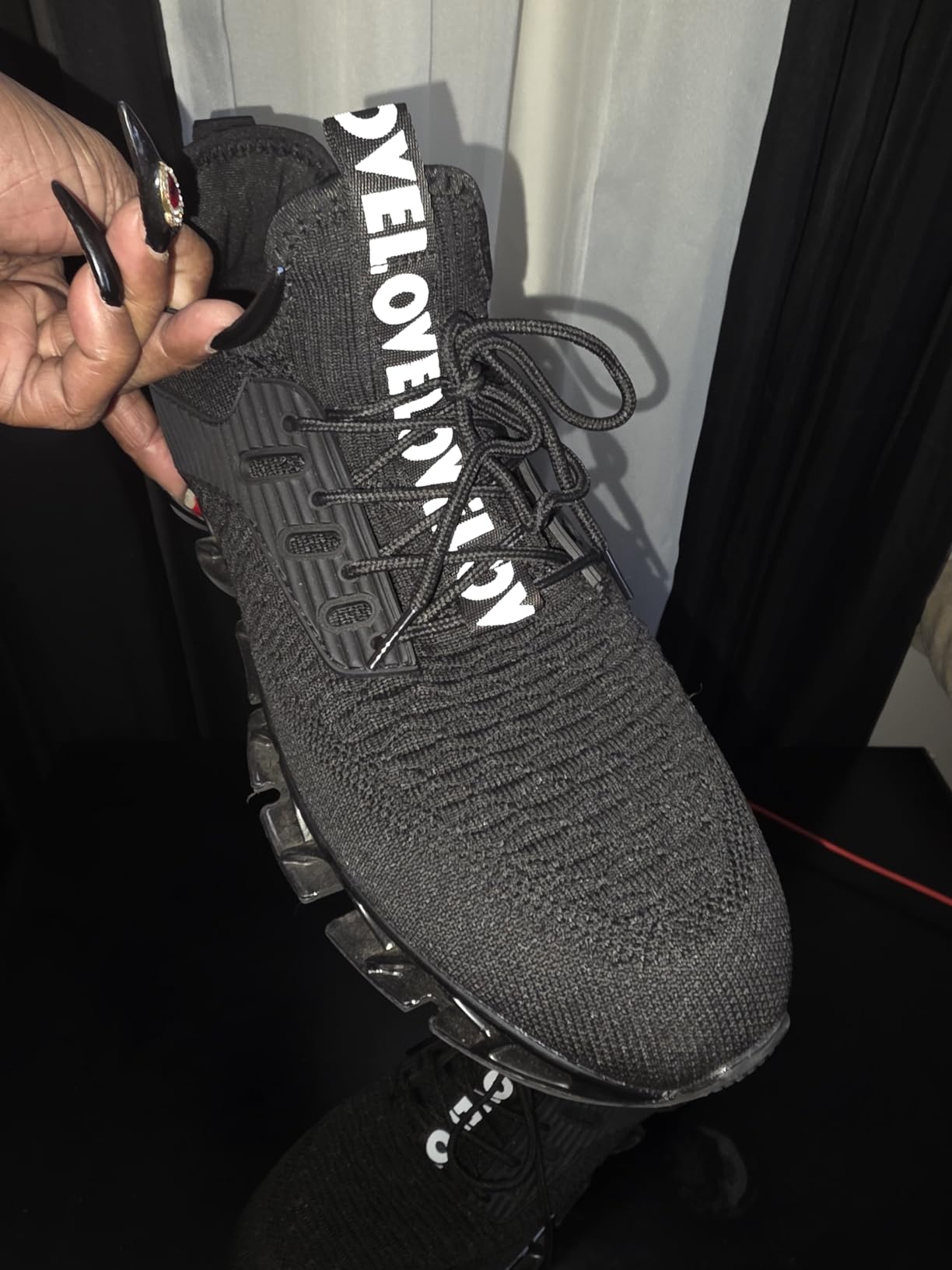 Side profile of Chopben Men's Running Shoes showing the blade sole silhouette and overall design