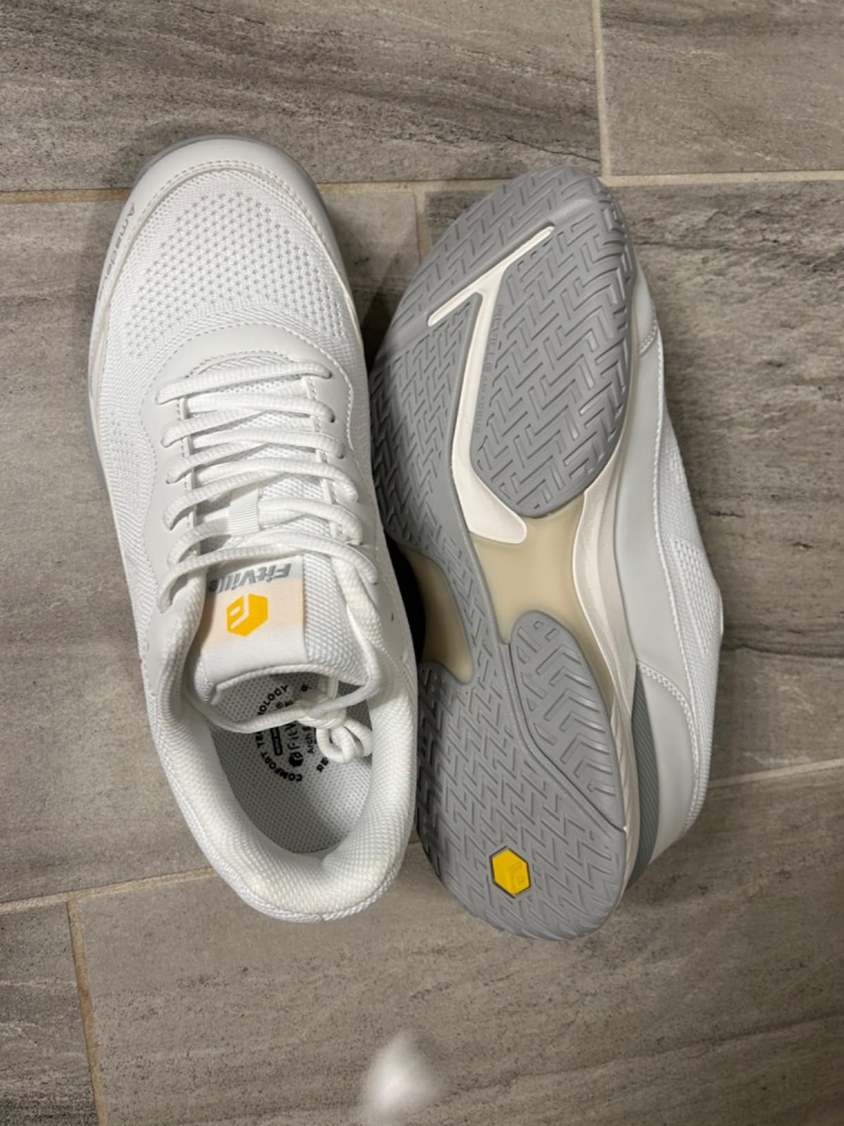 Pickleball players on court showing range of court footwear in recreational setting