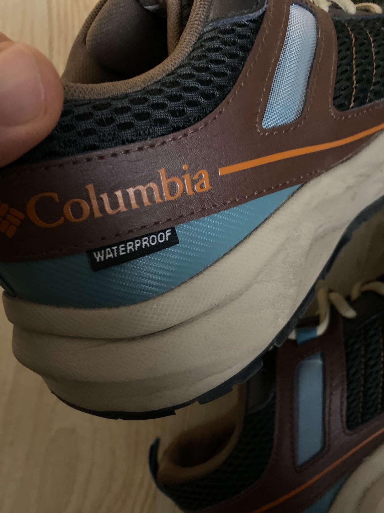 Columbia Plateau hiking shoe upper construction showing breathable textile mesh and strategic synthetic overlay reinforcement