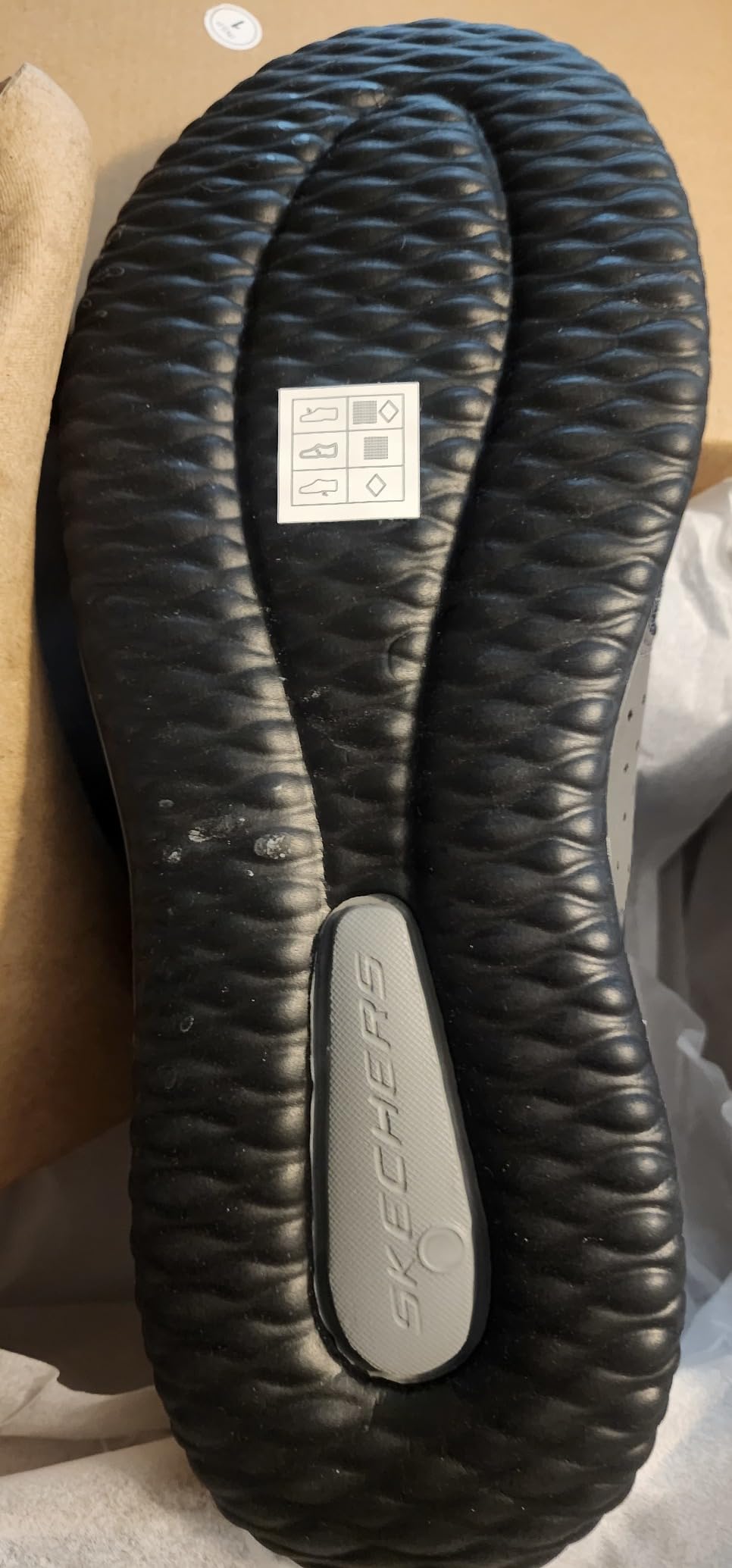 Skechers Delson-Camden shown in office business casual setting with chinos and dress pants