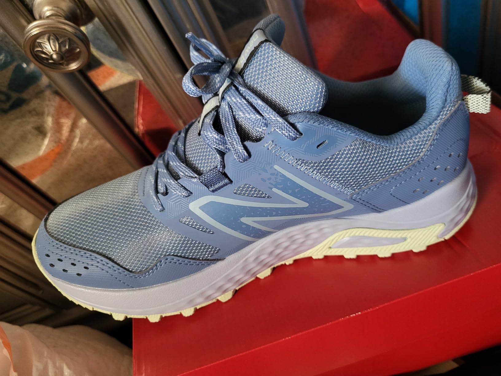 Bottom view of New Balance 410 V8 showing AT Tread outsole lug pattern and tread design