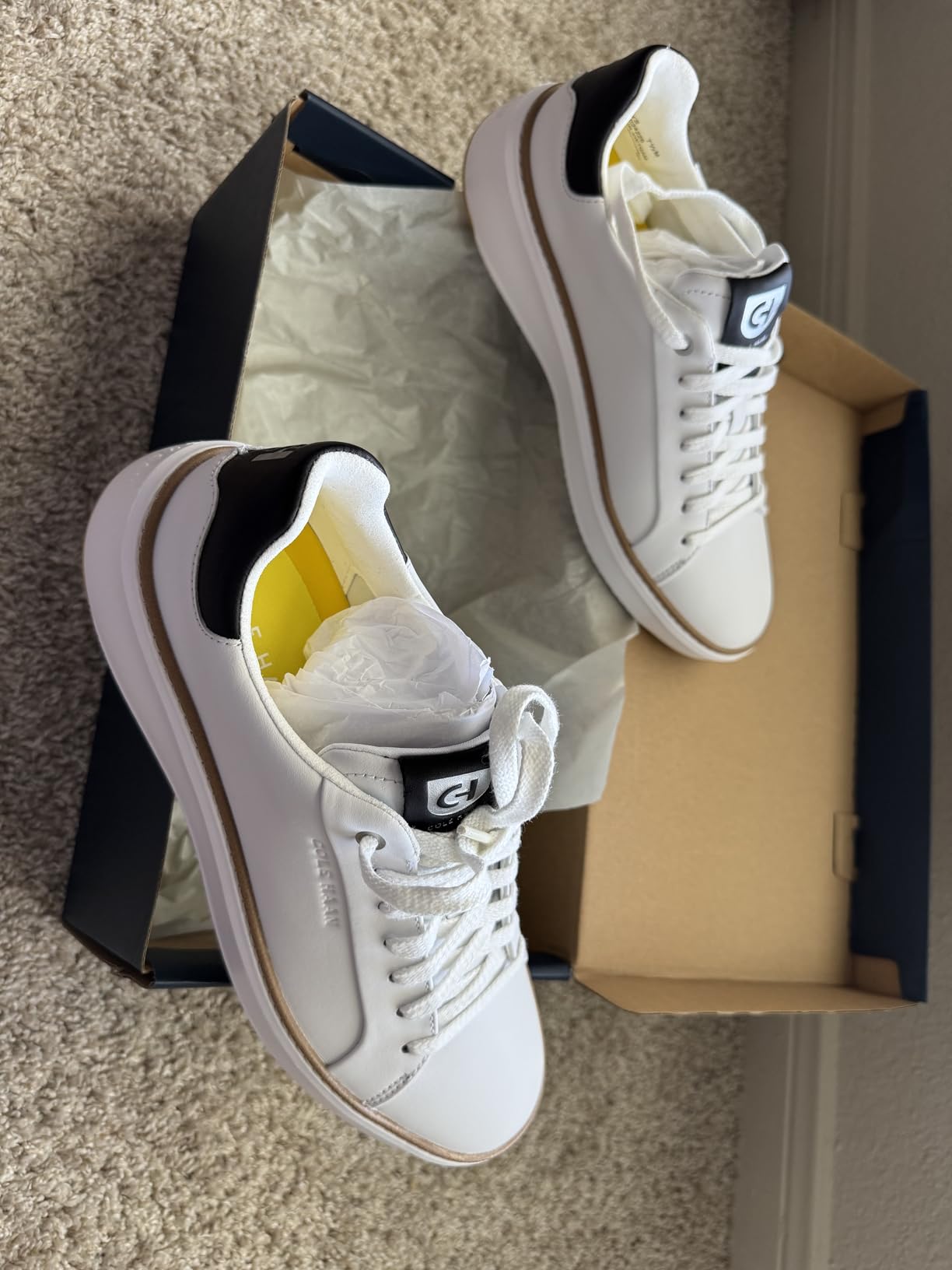 Cole Haan Men's Grandpro Topspin Sneaker in premium white leather showcasing golf-inspired design and clean construction