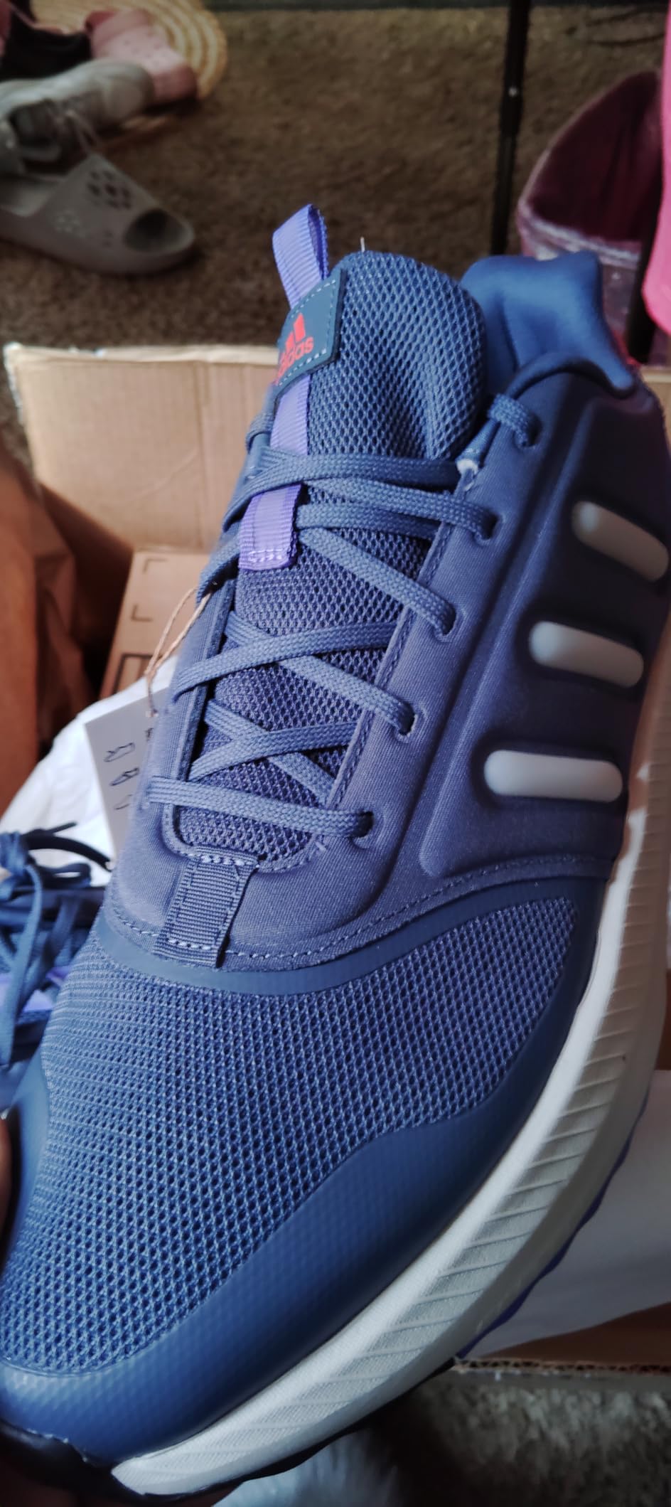 Multiple Adidas X_PLR Path colorway options showing navy, white, and additional color variants