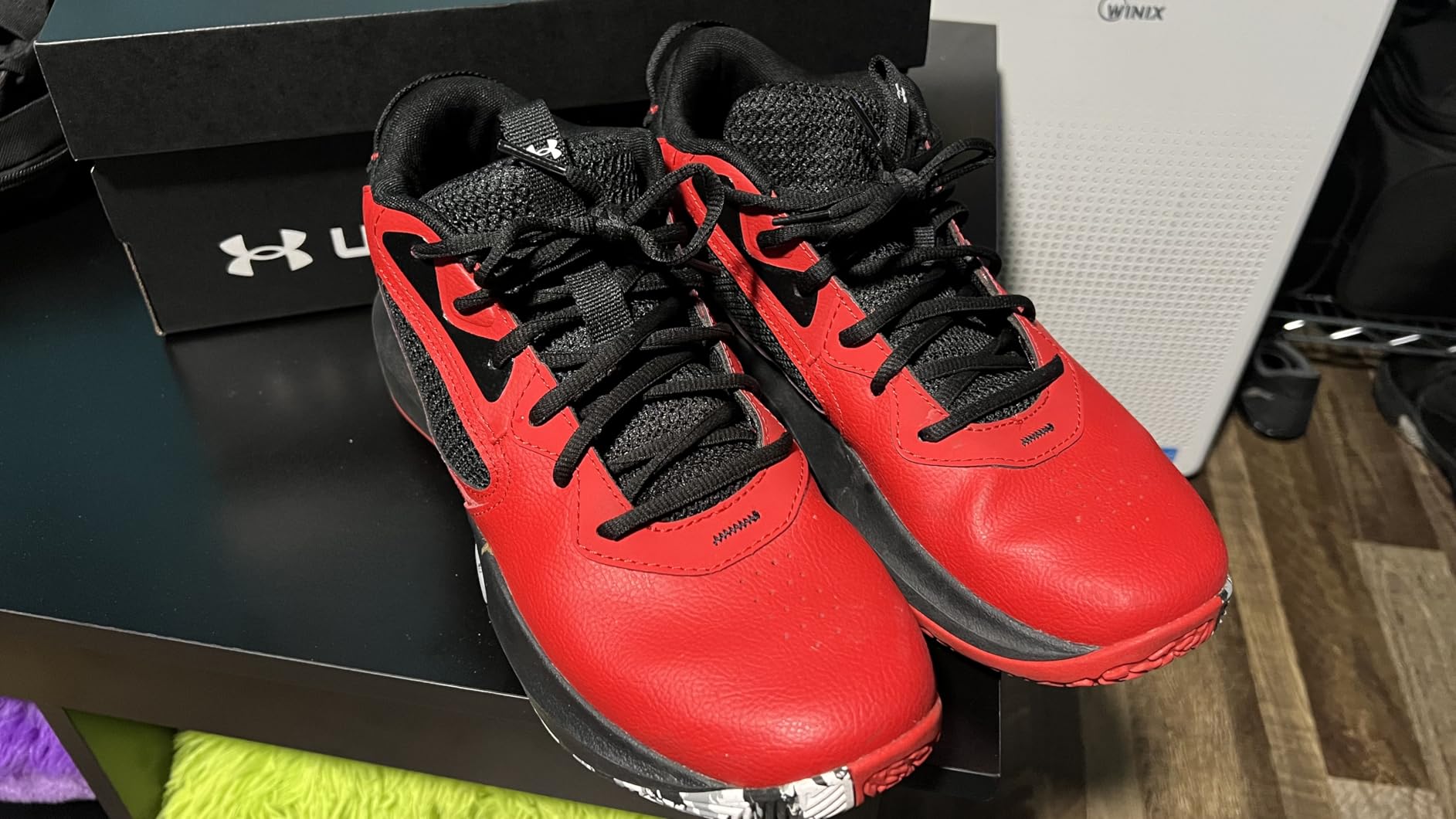 Under Armour Lockdown 6 basketball shoes full view showing black colorway with leather upper and mesh panels