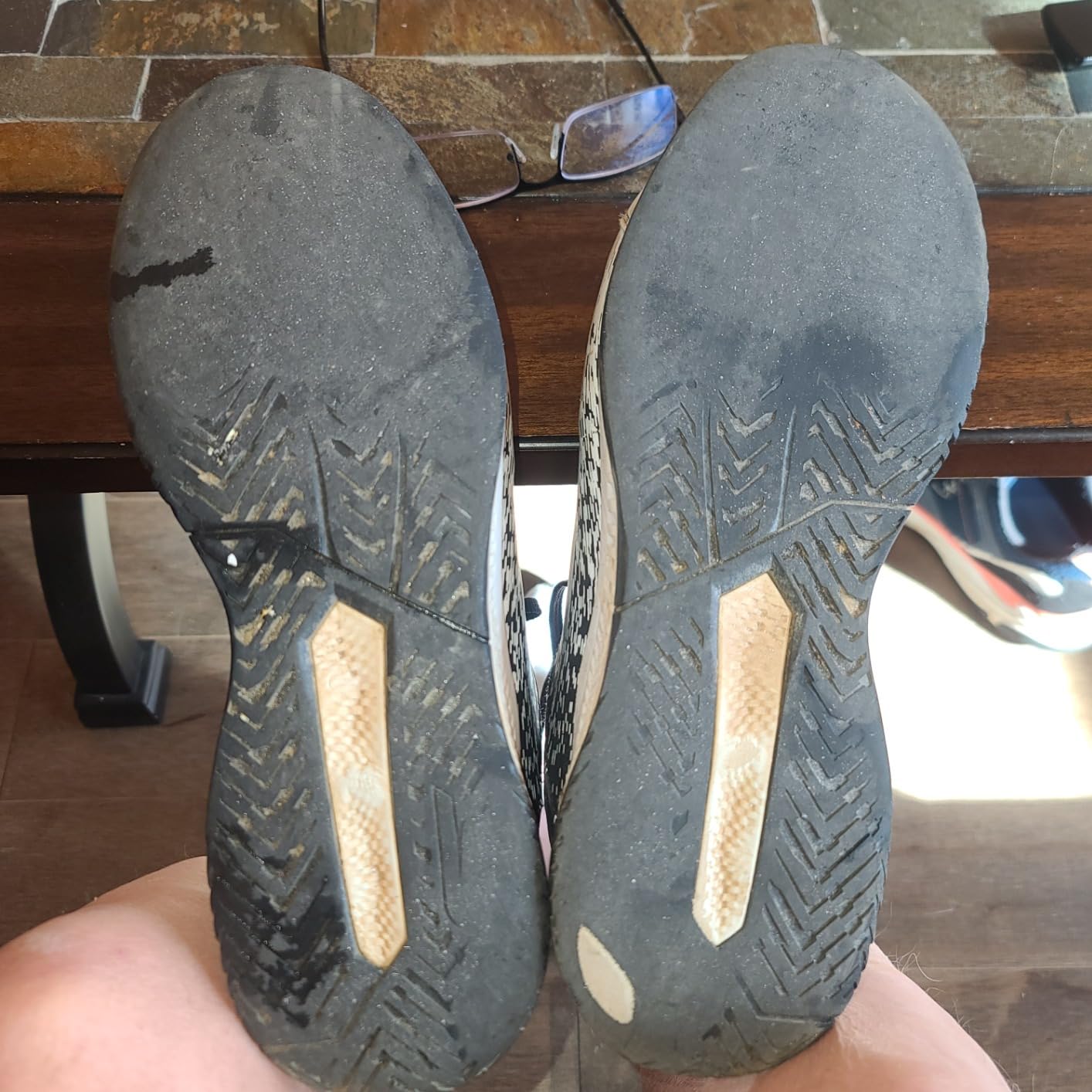 Sole wear pattern after 4 months of use showing Goodyear rubber deterioration and outsole wear at forefoot from outdoor court use