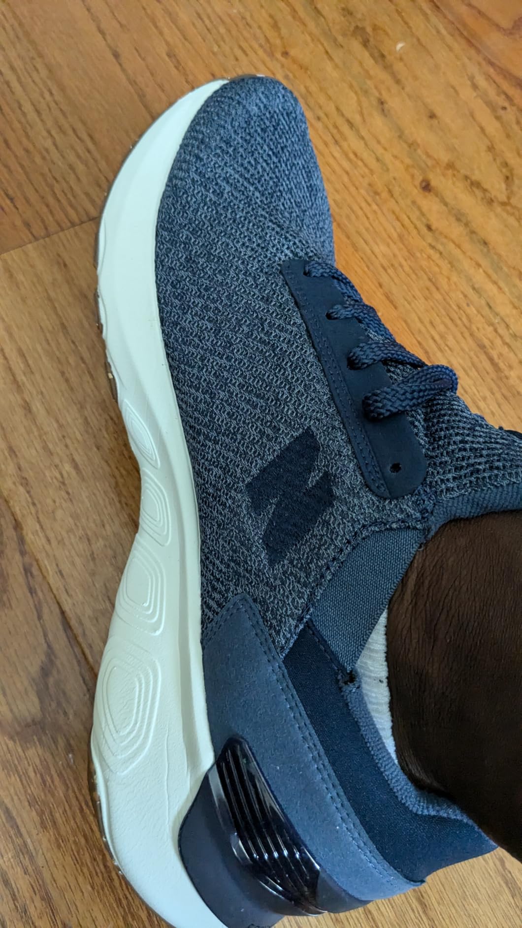 New Balance 1440 V1 fit detail showing heel clip structure and sizing consideration