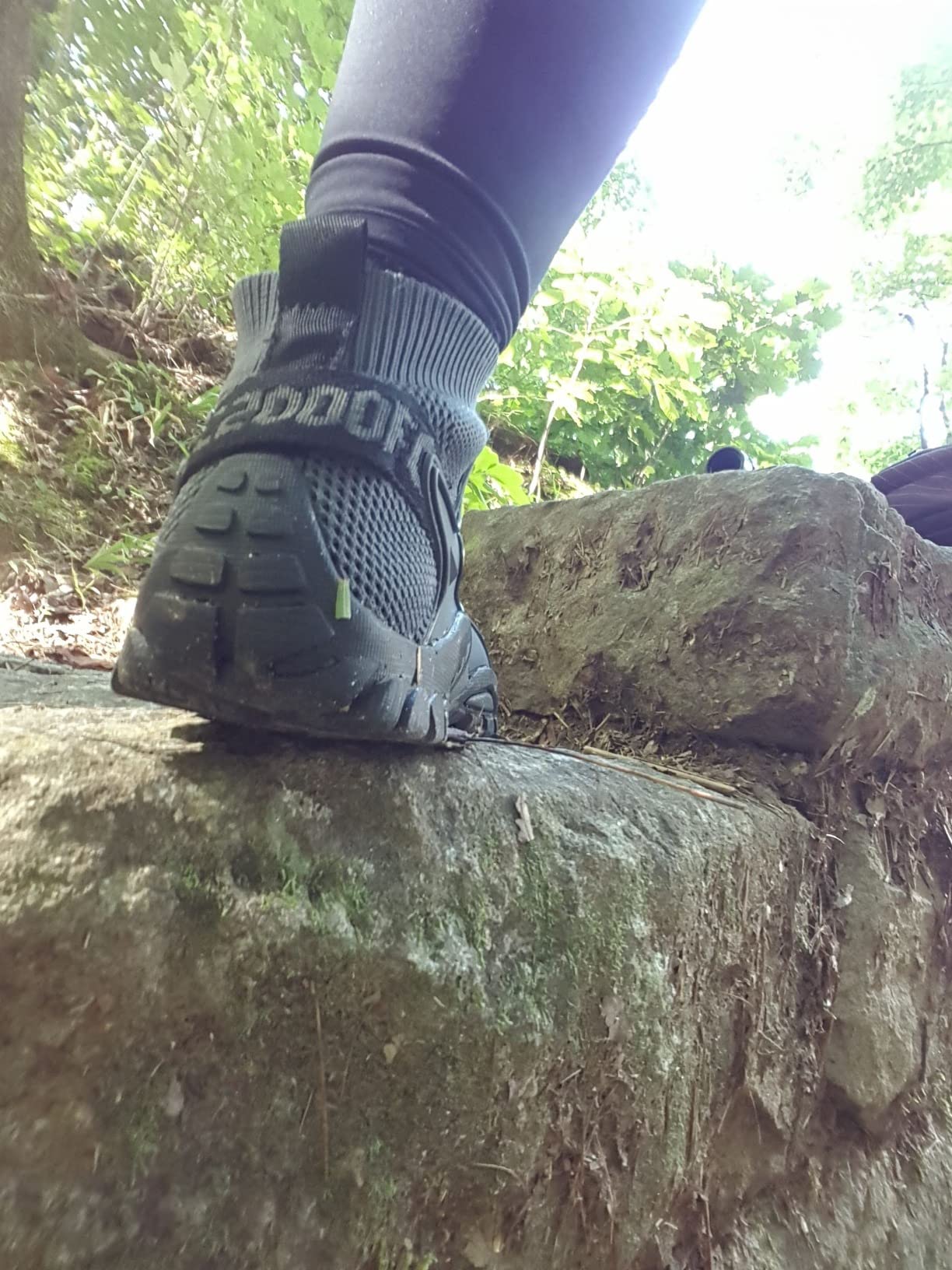 Hiking shoes on outdoor trail showing grip performance and traction on varied terrain