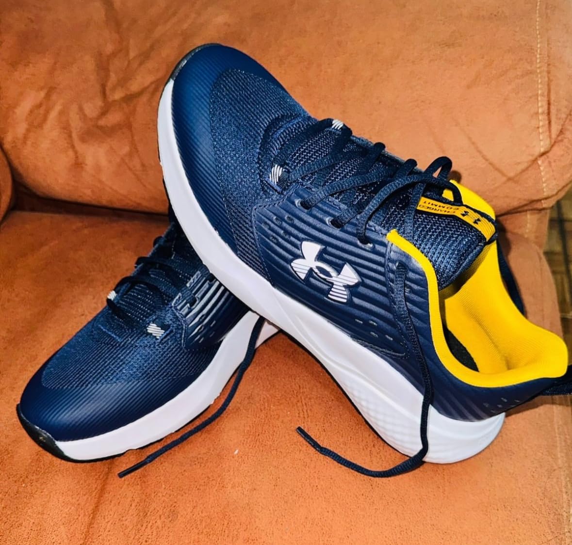 Under Armour Commit Trainer 4 — Mesh upper and leather overlay detail