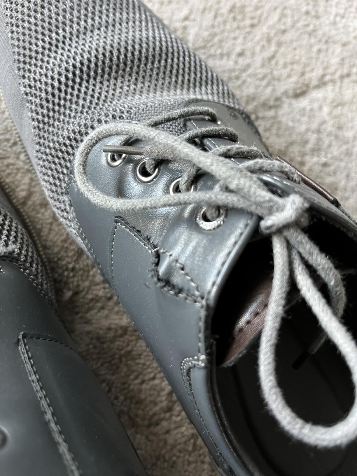 Close-up showing seam separation issue at upper-sole junction on Bruno Marc dress shoe after extended wear