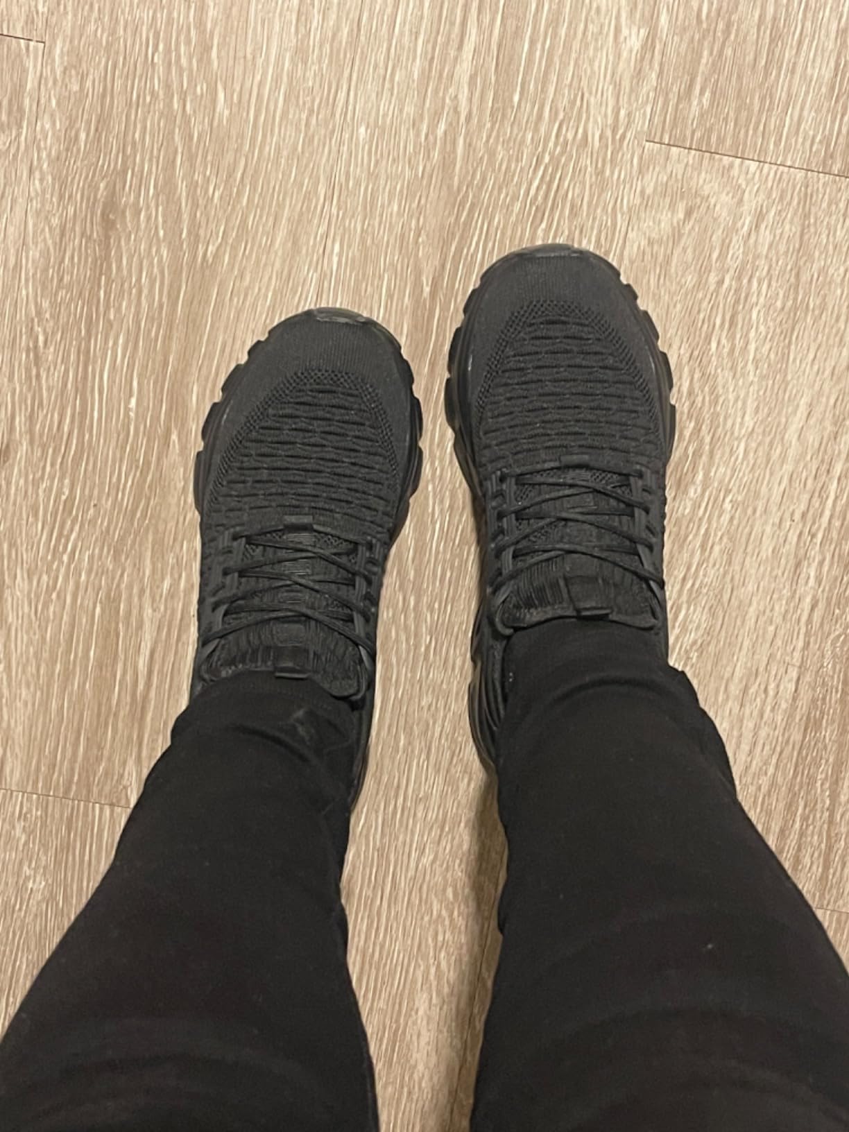 Close-up of KEEZMZ Women's Slip-On Sneaker showing knit mesh upper construction and pull-tab heel detail