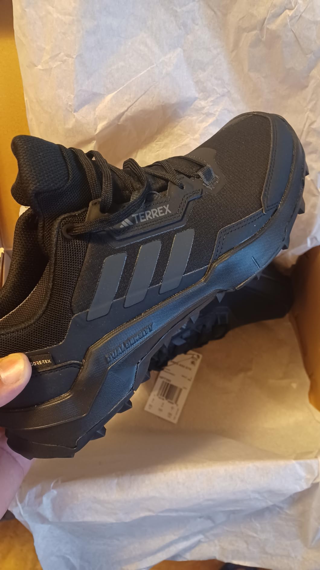 Adidas Terrex AX4 lacing system detail showing reinforced eyelets and flat lace construction