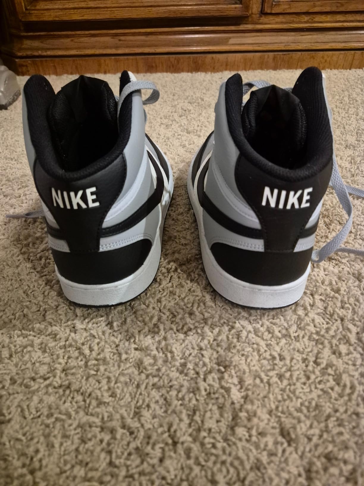 Nike Court Vision Mid white and black colorway showing classic basketball-inspired lifestyle sneaker design