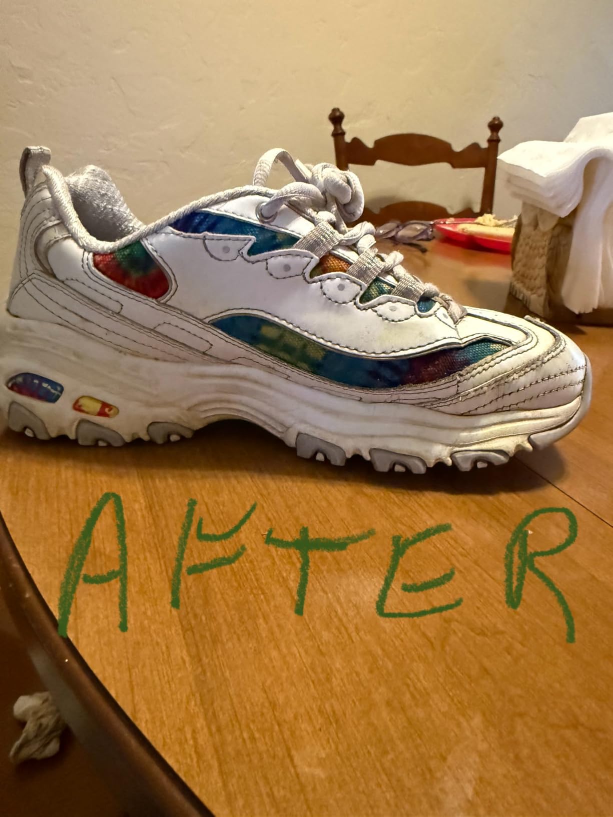 Grandma's Secret Sneaker Cleaner bottle next to before and after shoes showing dramatic stain removal results
