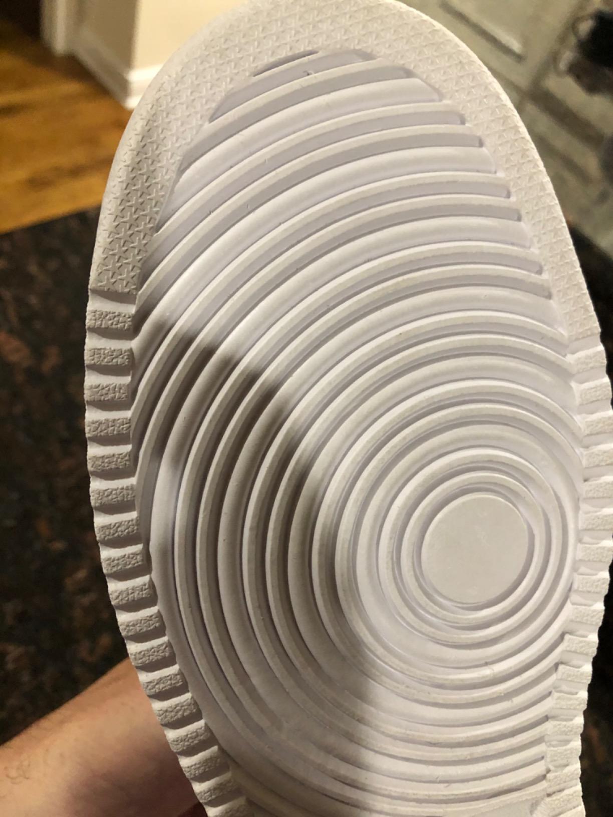 Nike Ebernon Low detail showing genuine leather upper construction and quality stitching on the vamp and quarter panels