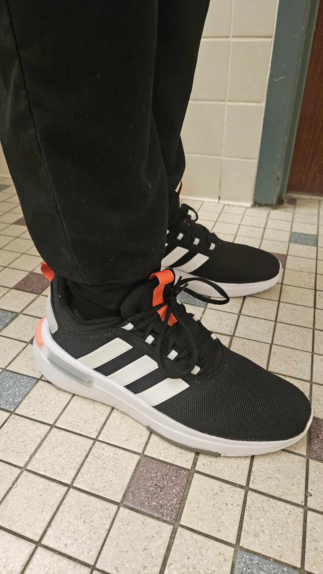 Adidas Men's Racer TR23 sneakers in carbon black and royal blue colorway showing full silhouette