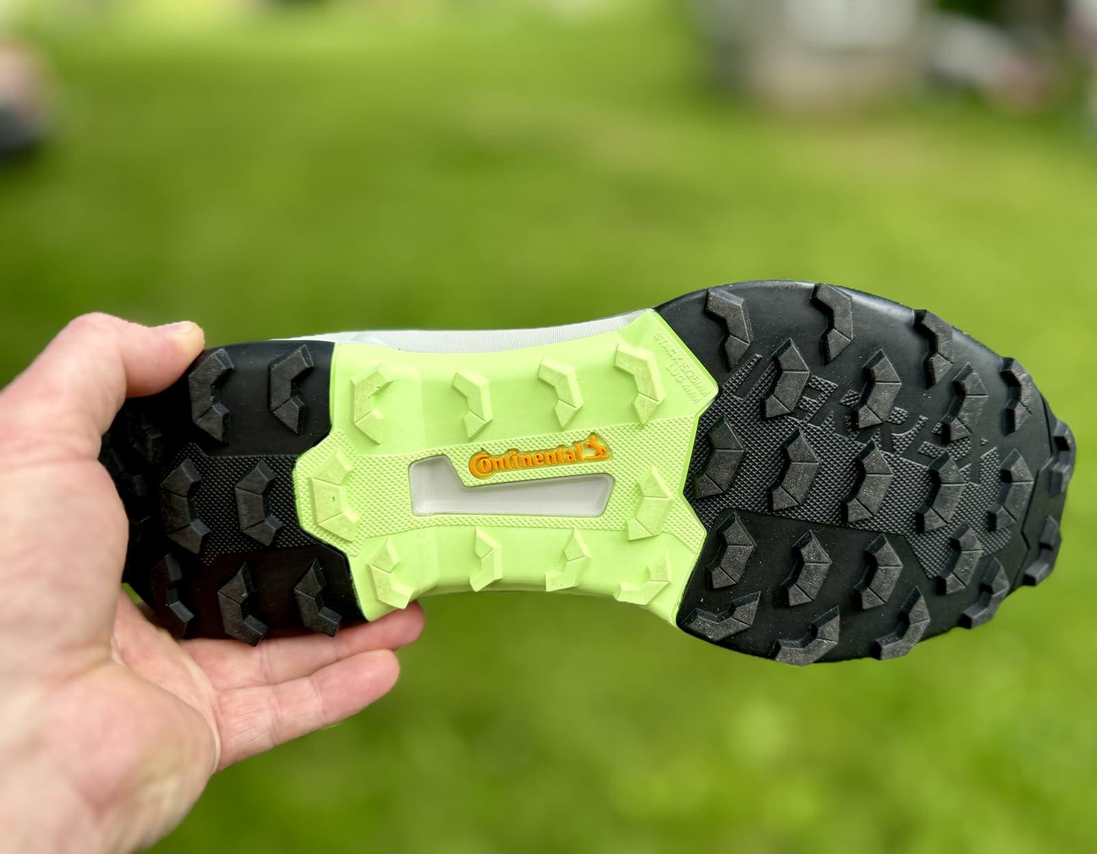 Close-up of Adidas Terrex AX4 upper construction showing abrasion-resistant mesh panels and synthetic overlays
