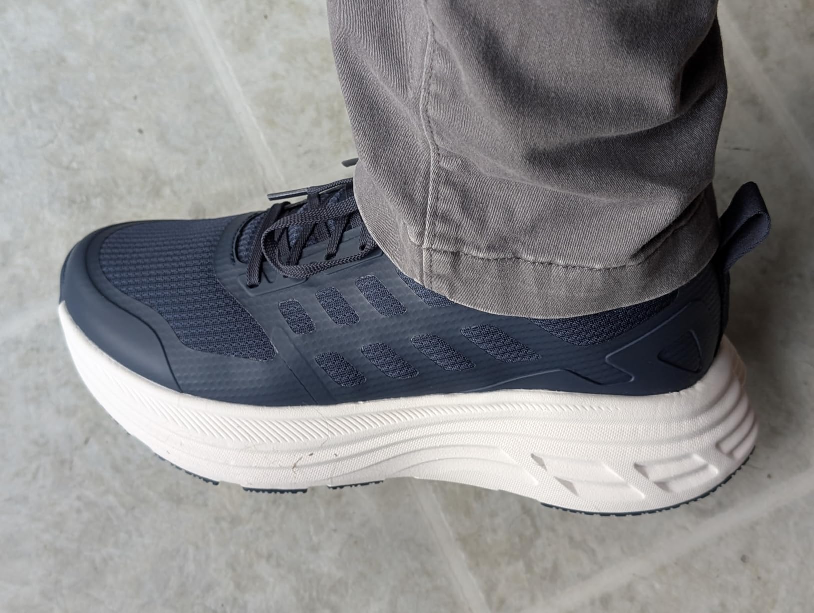 NORTIV 8 ActiveFloat walking shoes in all-black colorway showing full side profile with thick EVA midsole and mesh upper construction