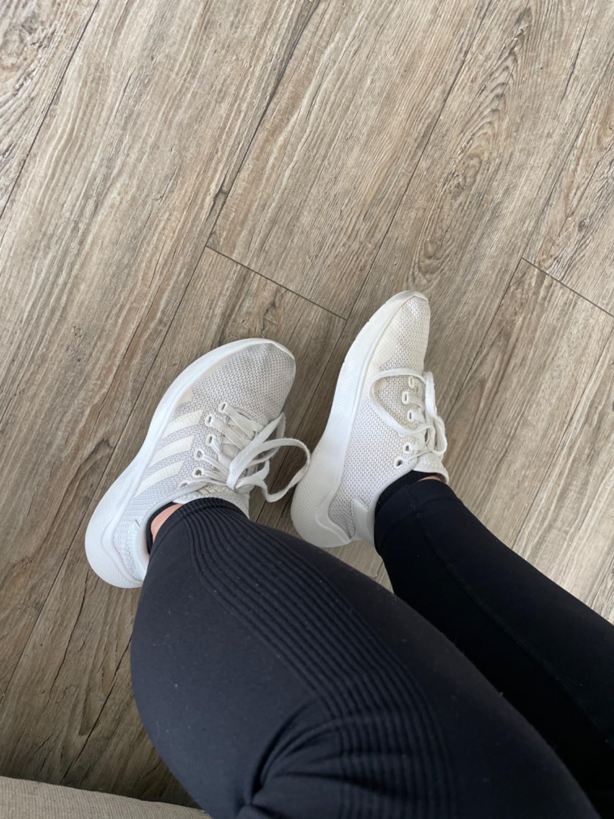 Adidas Puremotion 2.0 detail showing knit upper texture and three stripes design