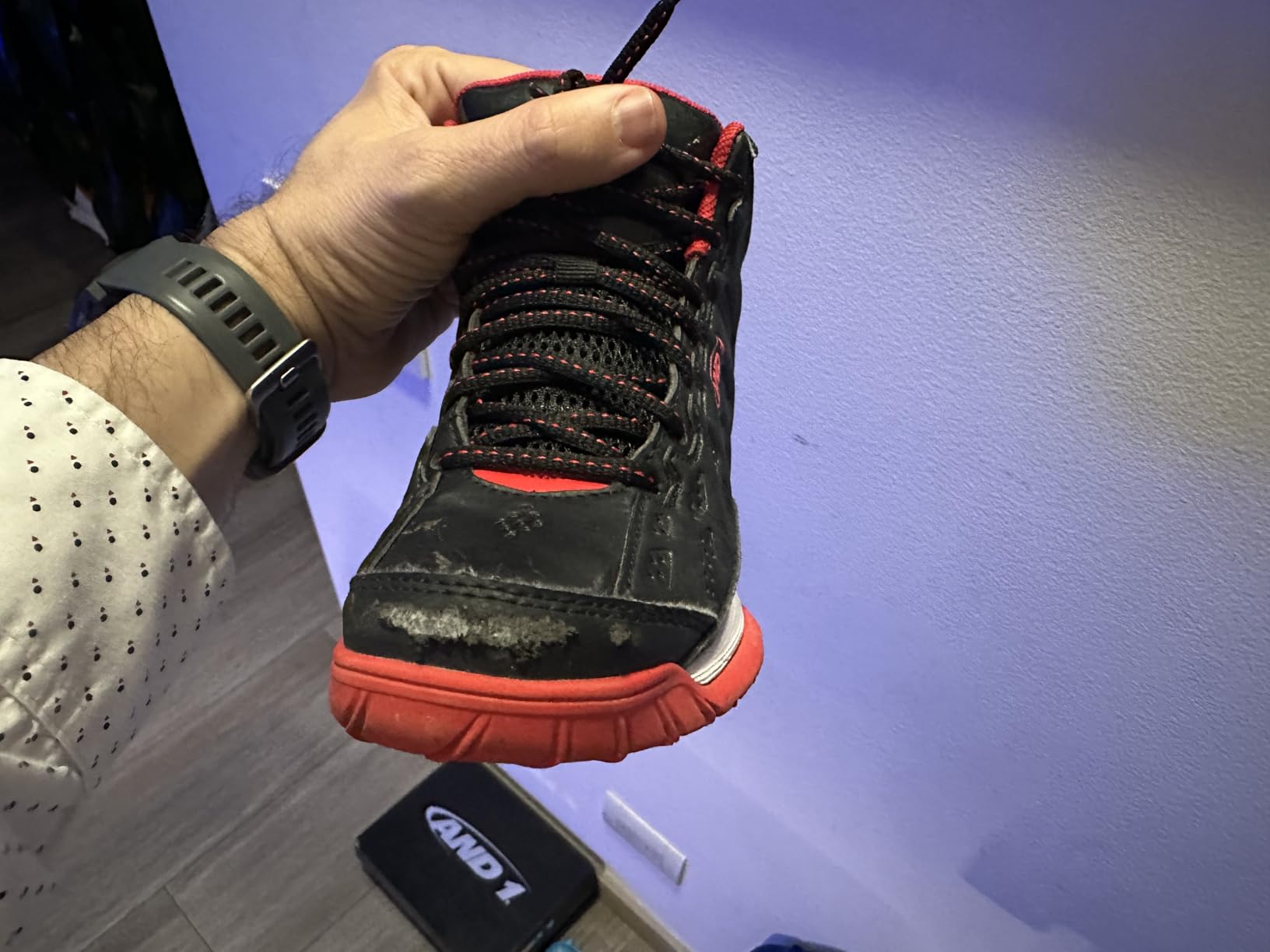 AND1 Showout kids basketball shoes showing significant wear damage and sole separation after four weeks of use