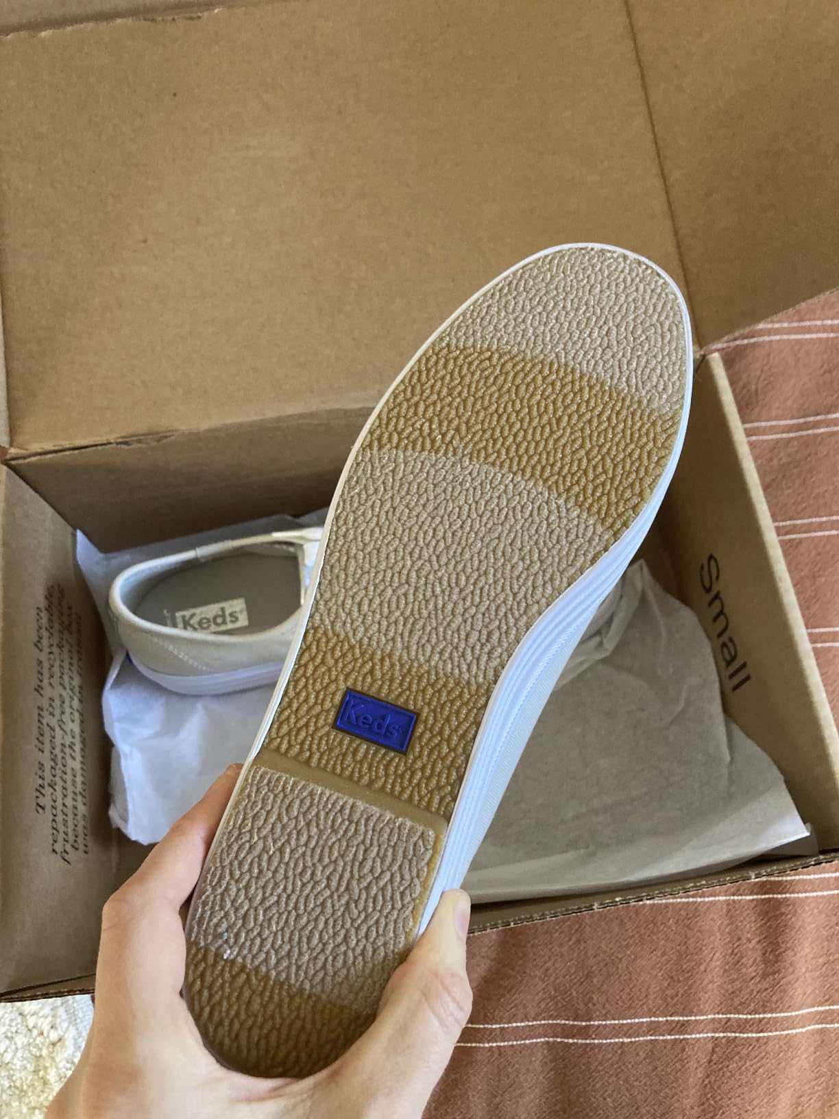 Side view of Keds Triple Up showing platform height profile and leather construction from heel to toe