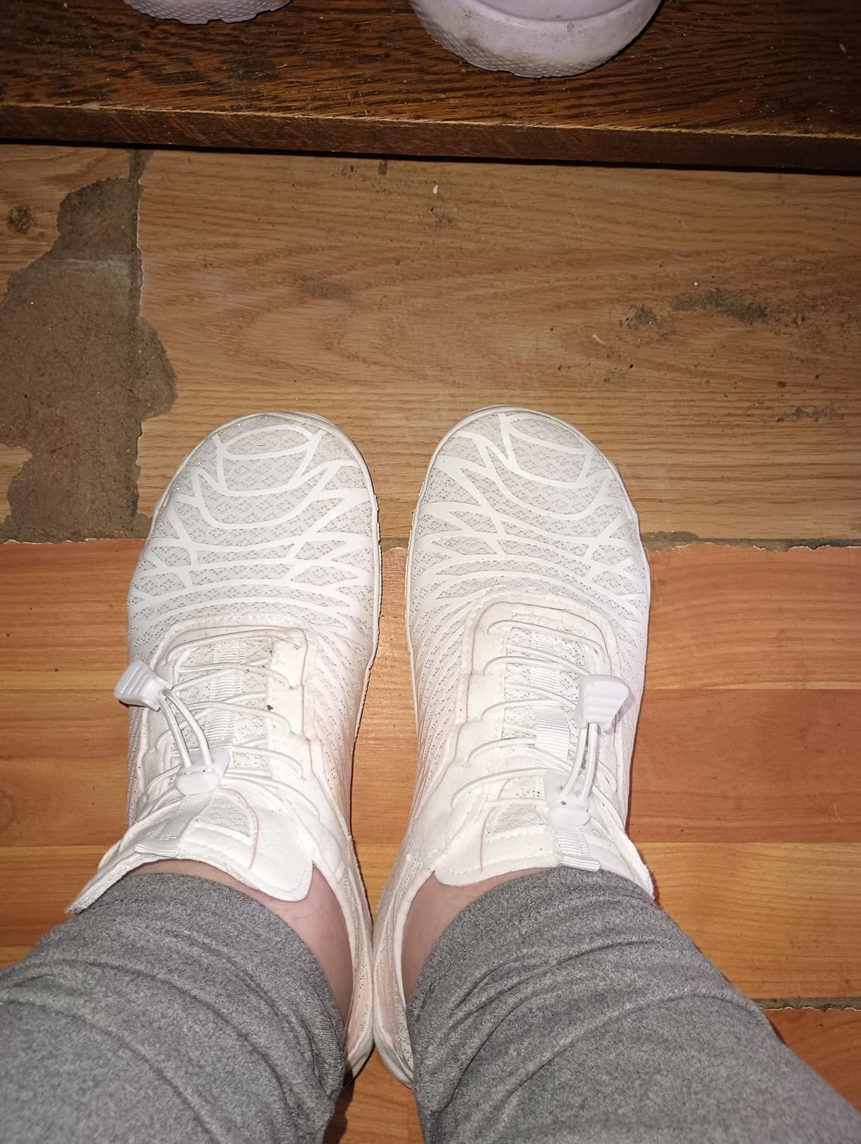 Side profile view of ELETON barefoot shoe showing minimal sole height and natural foot positioning