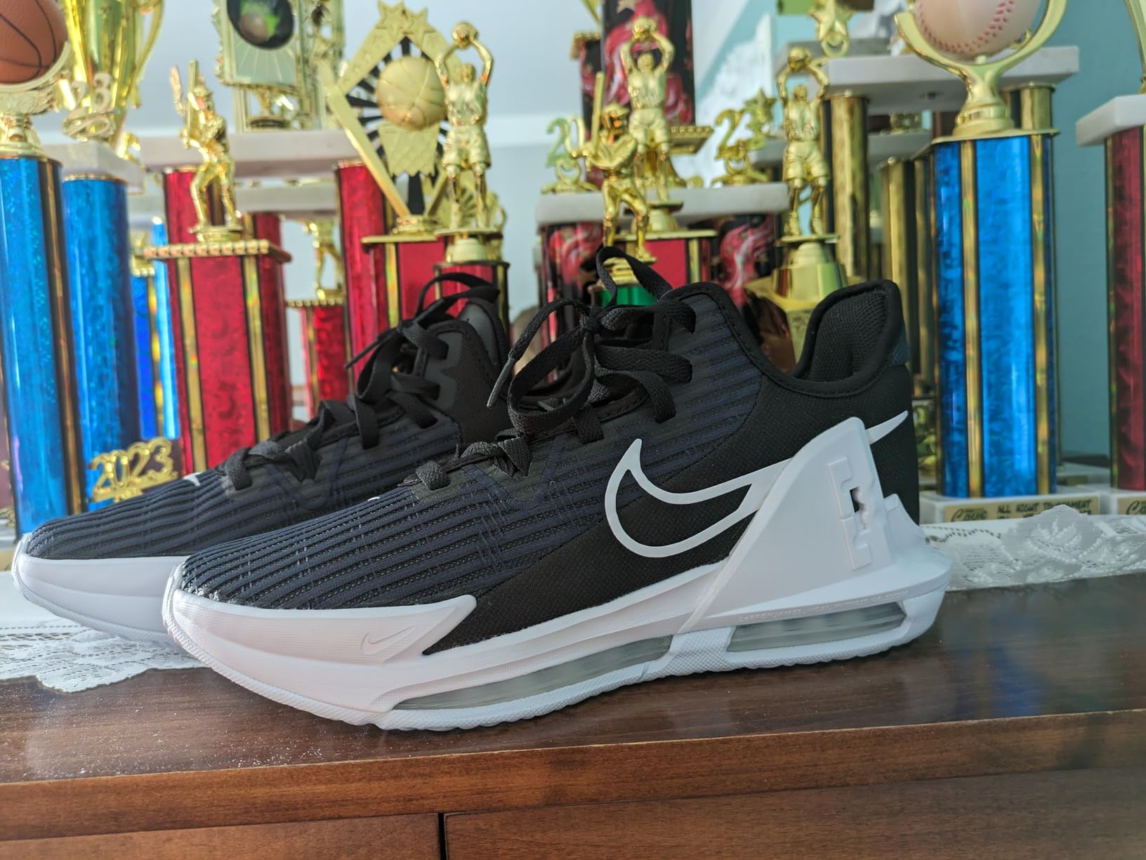 Nike LeBron Witness VI performance comparison across indoor hardwood and outdoor concrete court surfaces