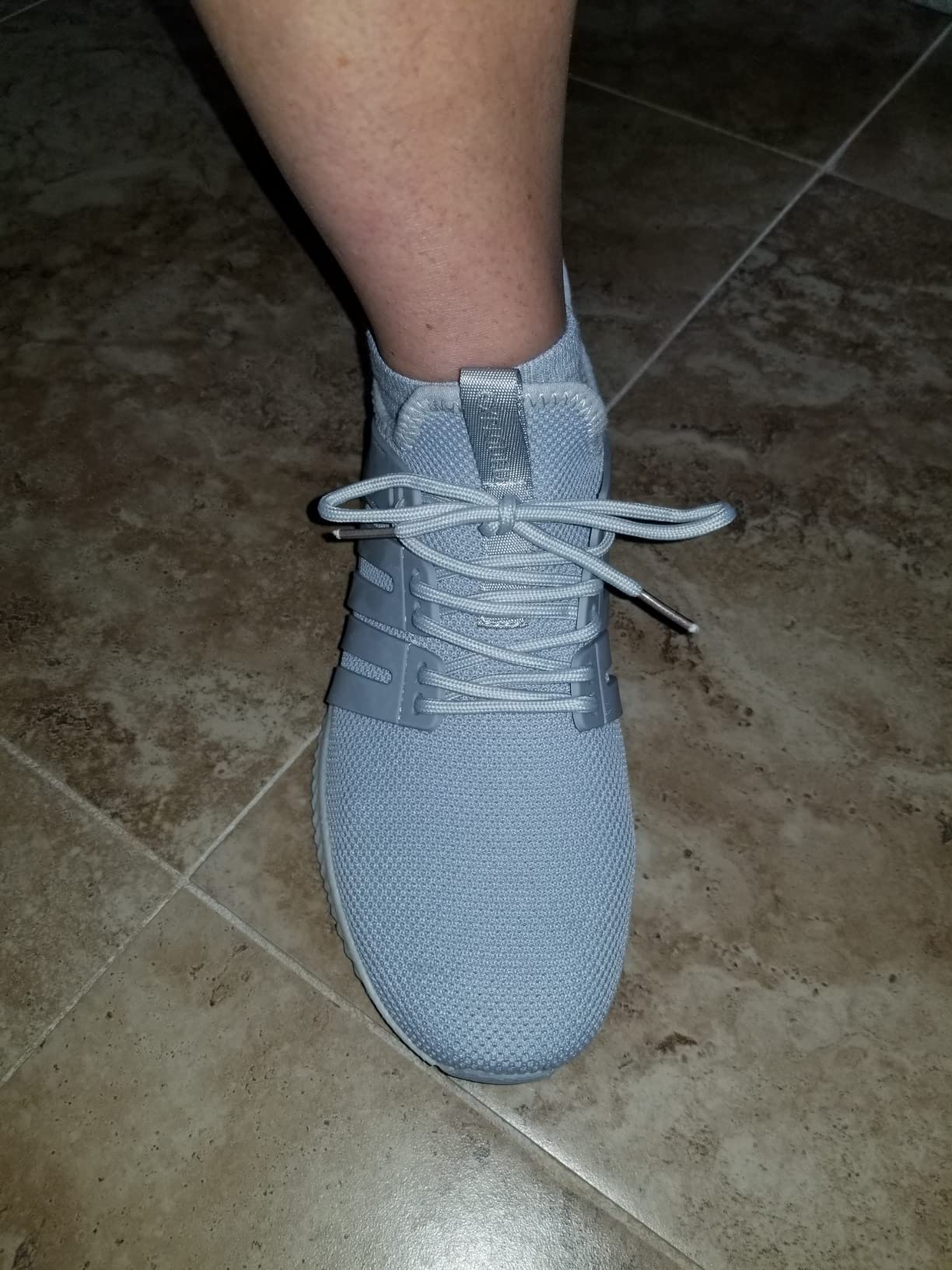 AKK sneakers action shot demonstrating flexibility and movement during exercise