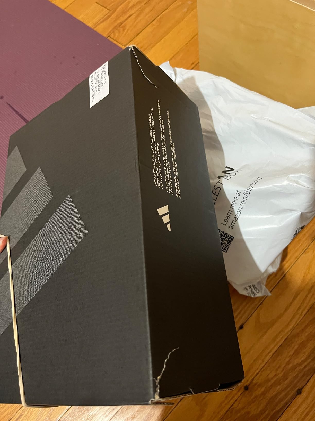 Adidas Gamecourt 2 product packaging showing tennis shoe marketing claims and specifications