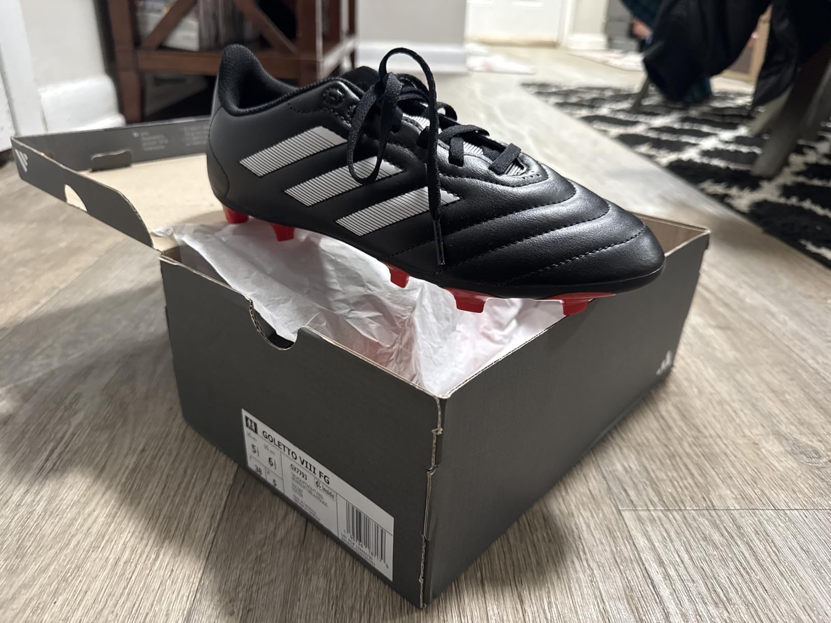 Close-up of Adidas Goletto VII synthetic upper material and stitching construction