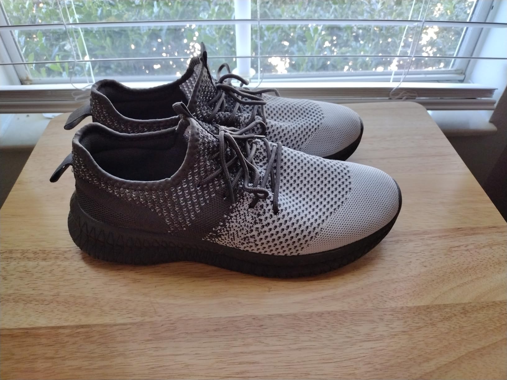 FUJEAK Men Running Shoes dark grey colorway showing breathable mesh upper and honeycomb sole design