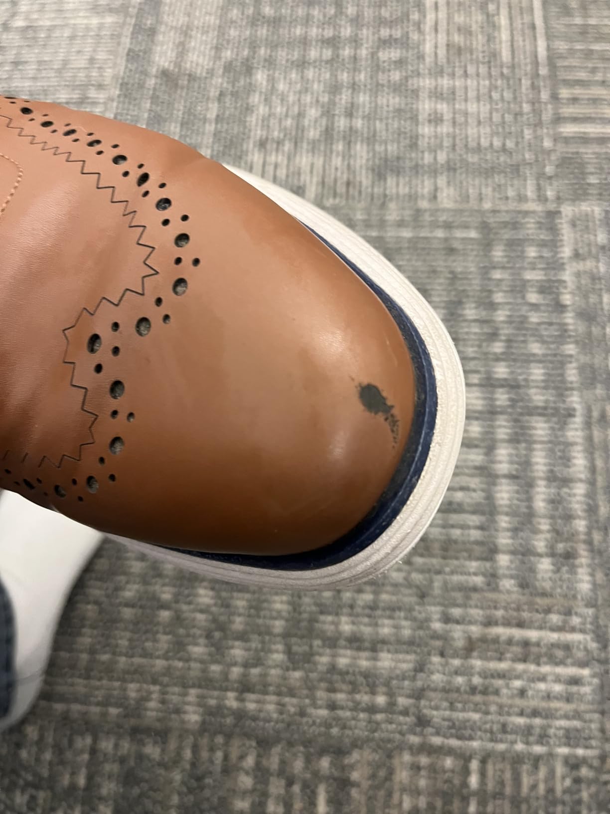 Bruno Marc MaxFlex dress sneakers in brown wingtip colorway on professional surface