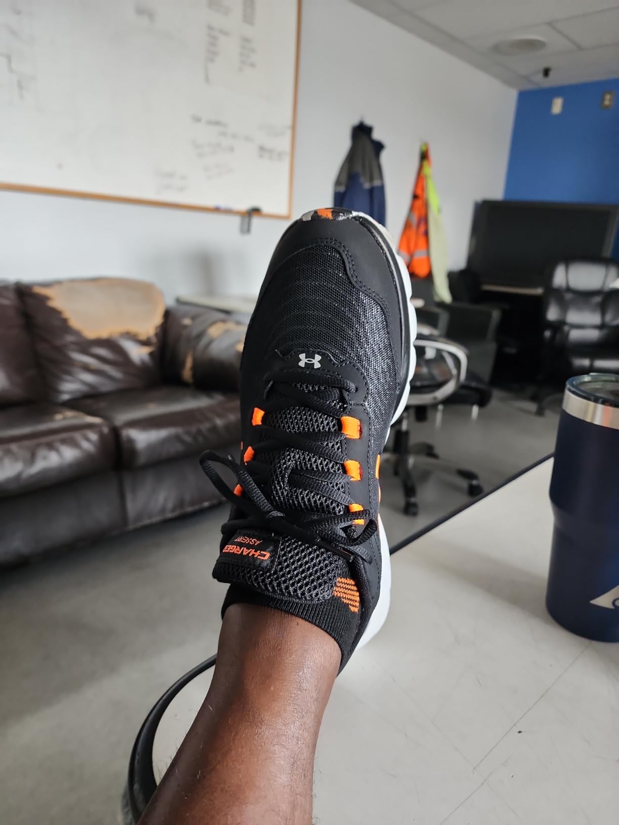 Under Armour Charged Assert 9 side profile showcasing the Charged Cushioning midsole technology with 34mm heel stack and 10.9mm drop design