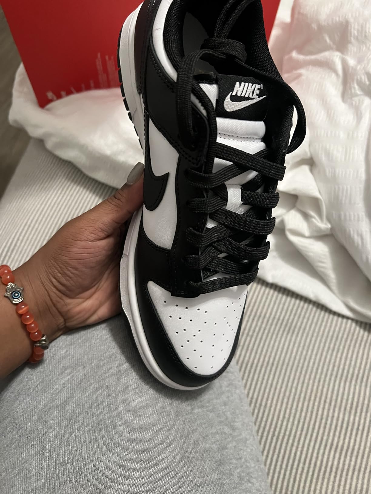 Nike Dunk Low authentic details showing Nike branding quality and construction