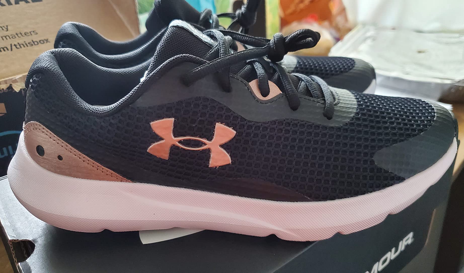 Under Armour Surge 3 side profile showing EVA midsole thickness and rubber pod outsole placement