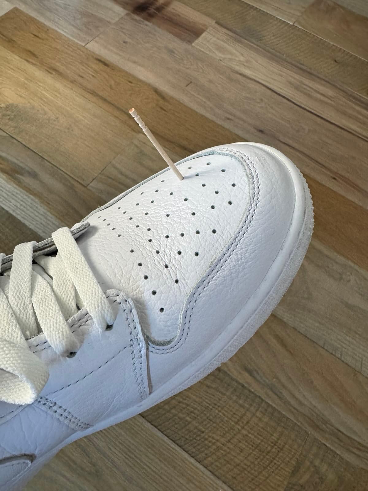 Jordan Air 1 Low showing detailed leather upper construction and classic cupsole design from side angle
