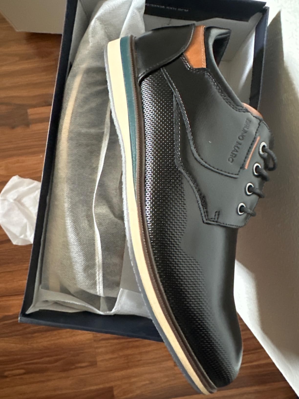 Side profile of Bruno Marc dress shoe showing lace-up closure and pointed toe silhouette