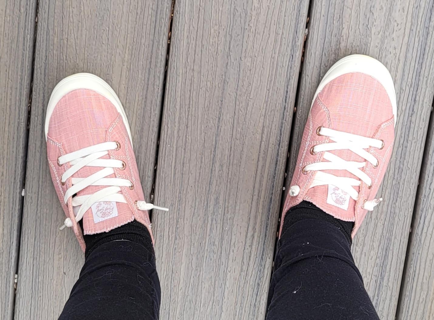Side profile of Roxy Rory sneaker showing slip-on collar stretch capability and overall silhouette