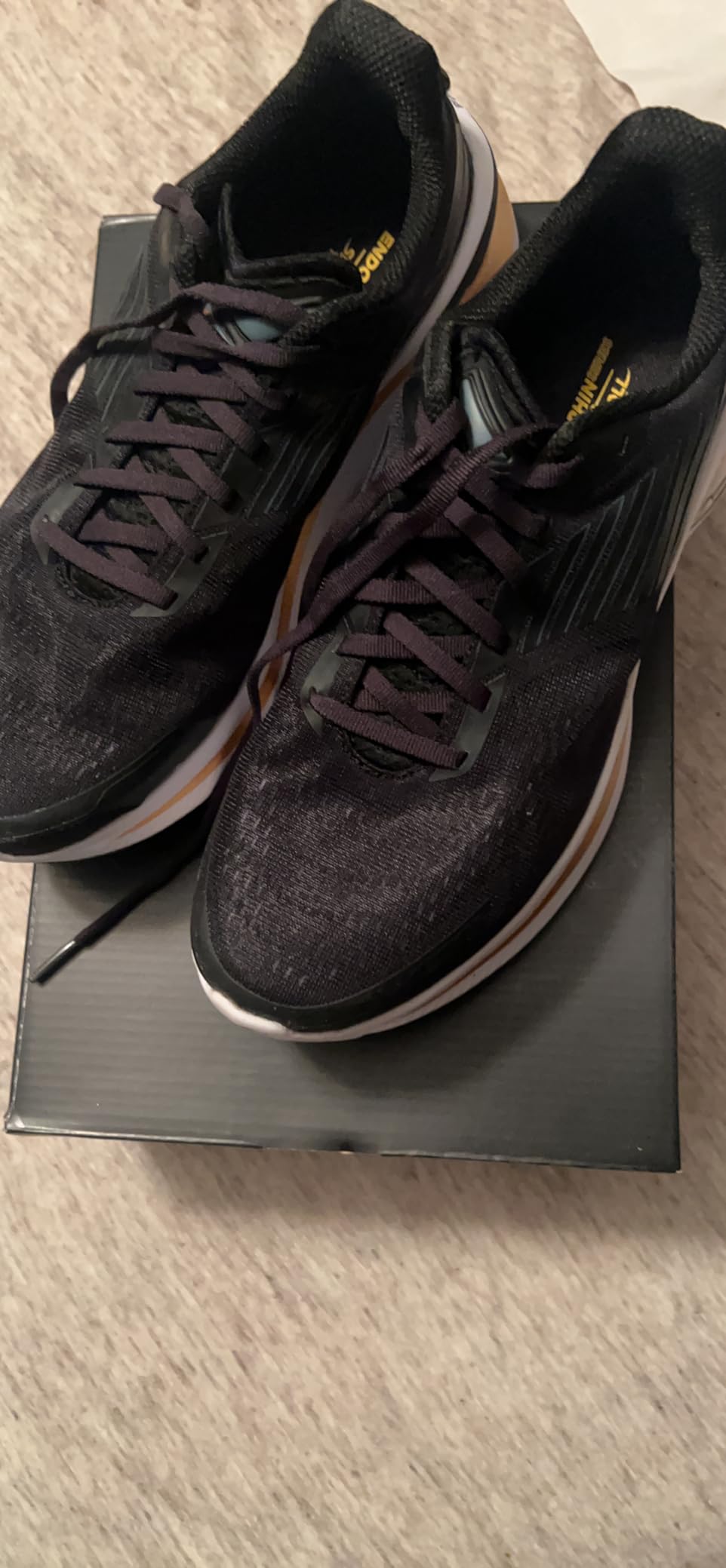 Saucony Endorphin Shift 3 showing PWRRUN foam technology and redesigned heel clip details