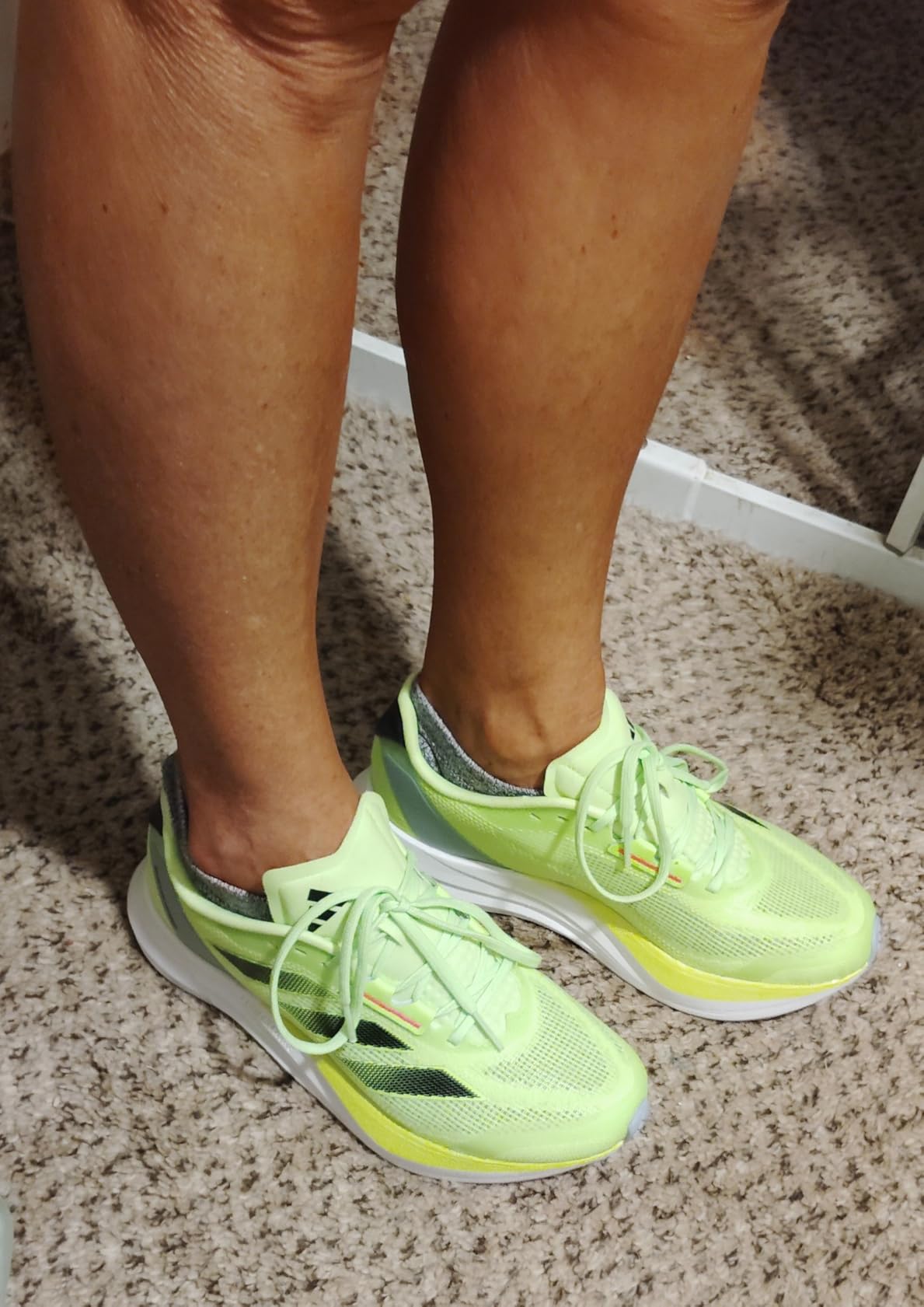 Adidas Women's Runfalcon 3 running shoes in neon yellow with black and pink accents on white background