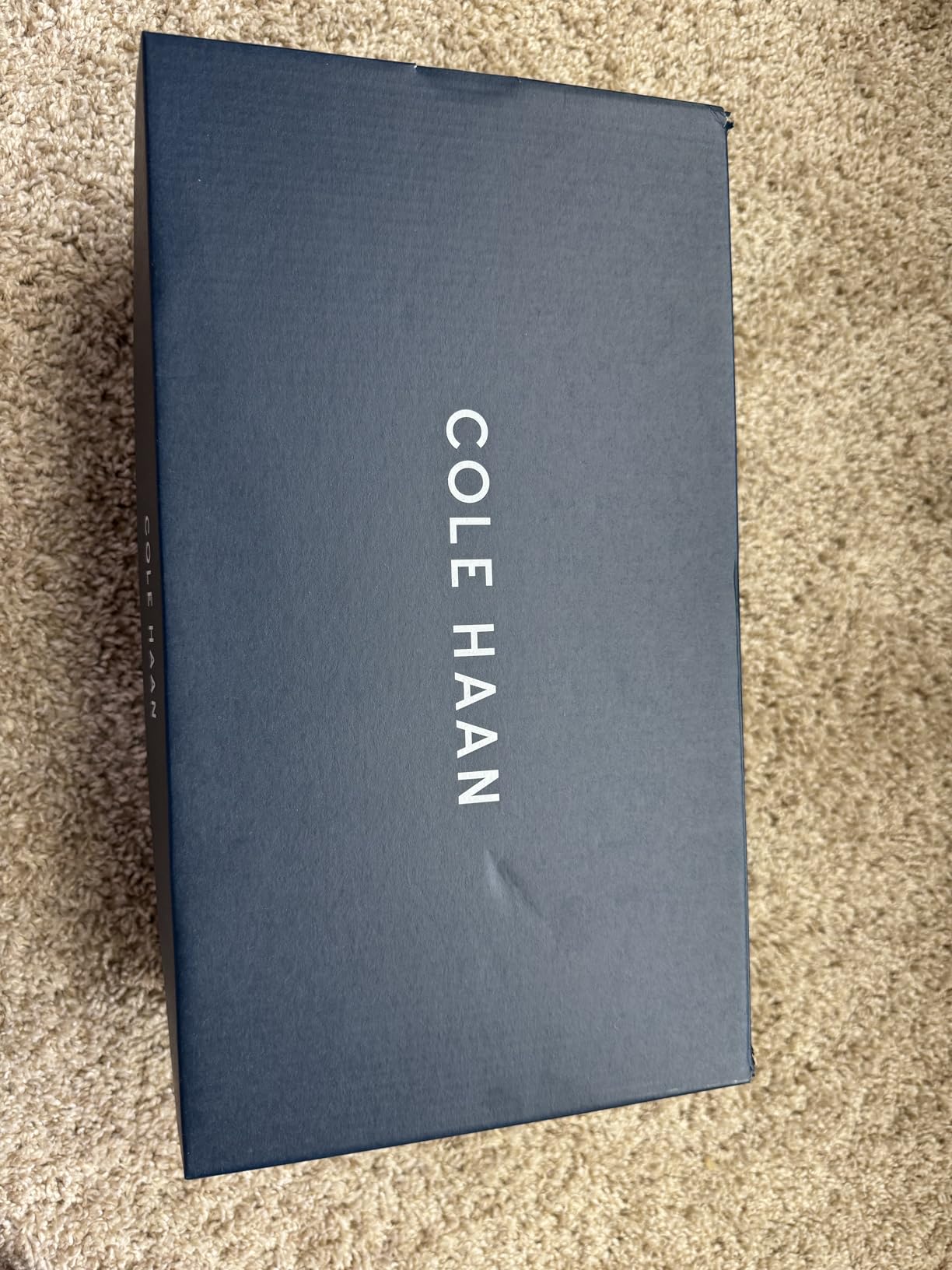 Side profile of Cole Haan Grandpro Topspin highlighting cushioned midsole and waterproof leather construction