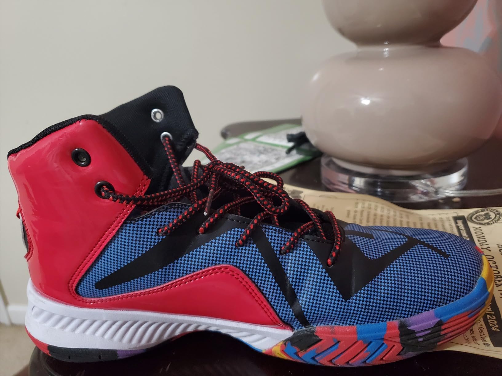 ASHION basketball shoes detail showing PU upper construction and mesh breathability panels